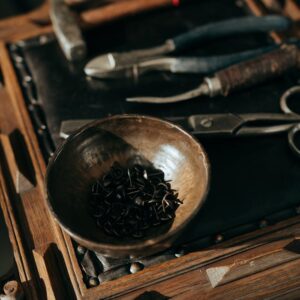 Black and Brown Round Bowl on Brown Wooden Table